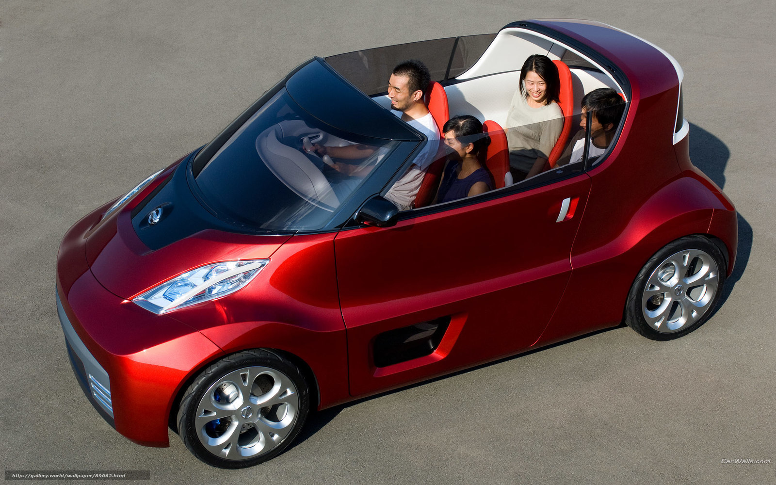 Red concept car with passengers