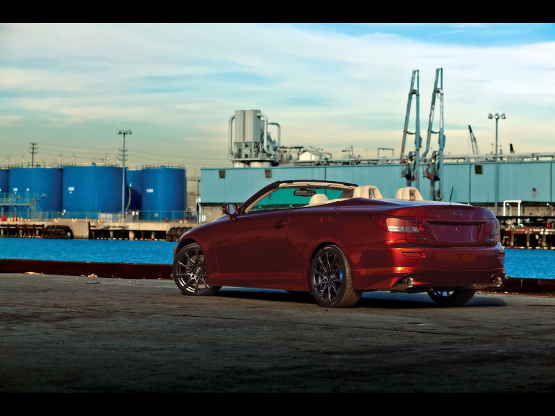 Red convertible at a port