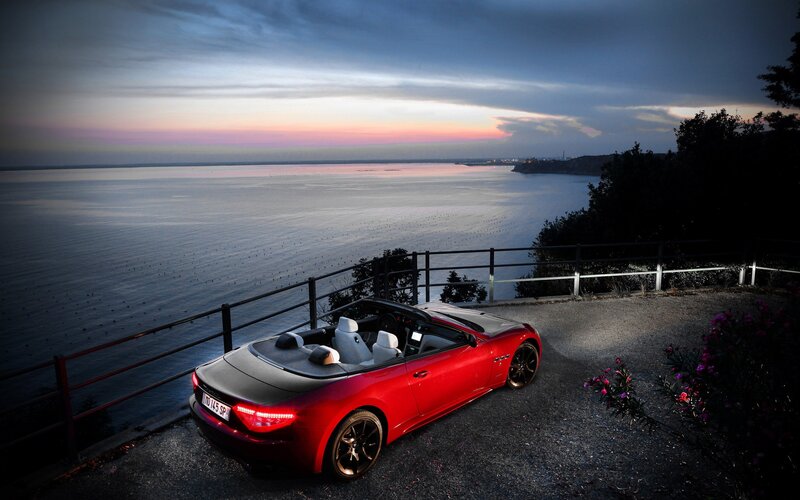 Red Convertible Car — Serene, Sunset, Photograph, Sea, Fence
