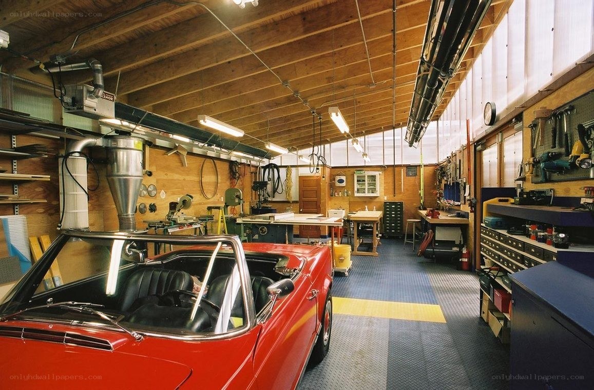 Red convertible in workshop