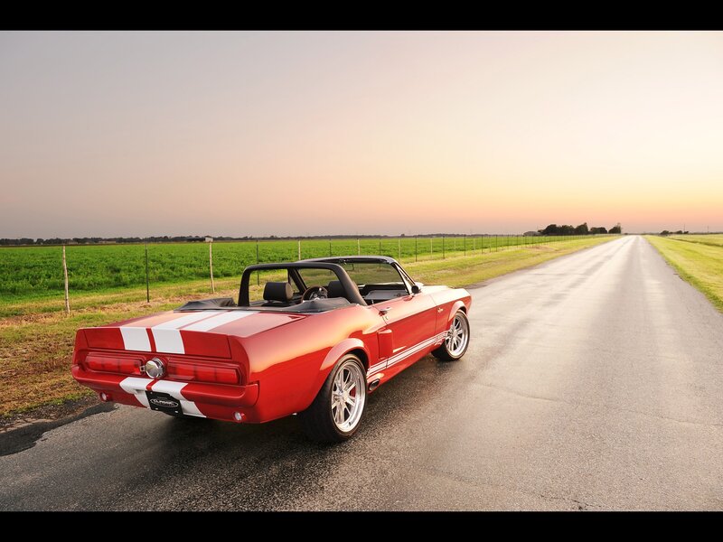 Red convertible on a country road