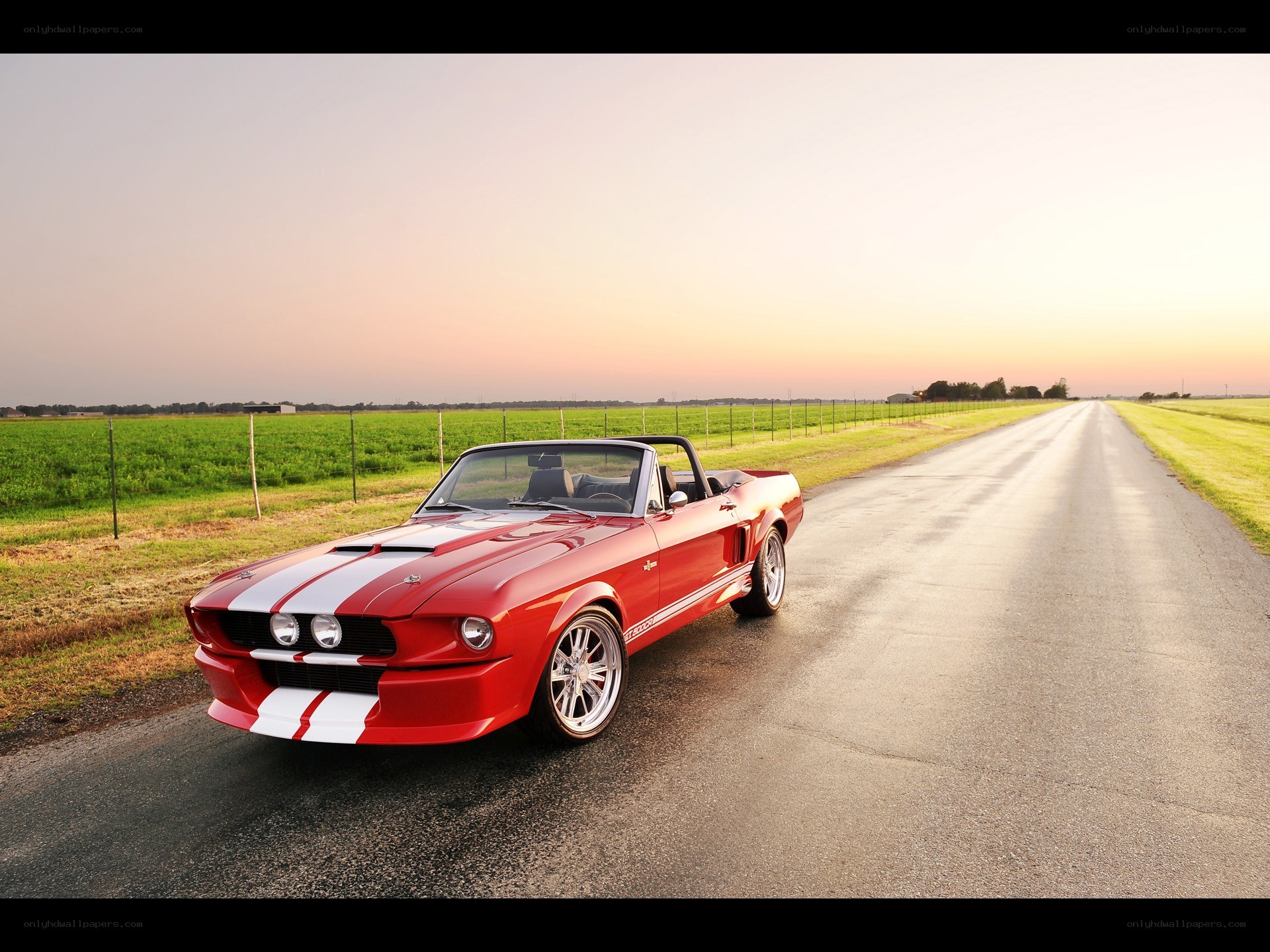 Red convertible on a country road