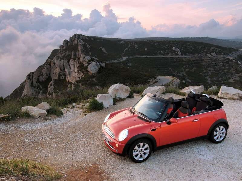 Red convertible on a mountain overlook