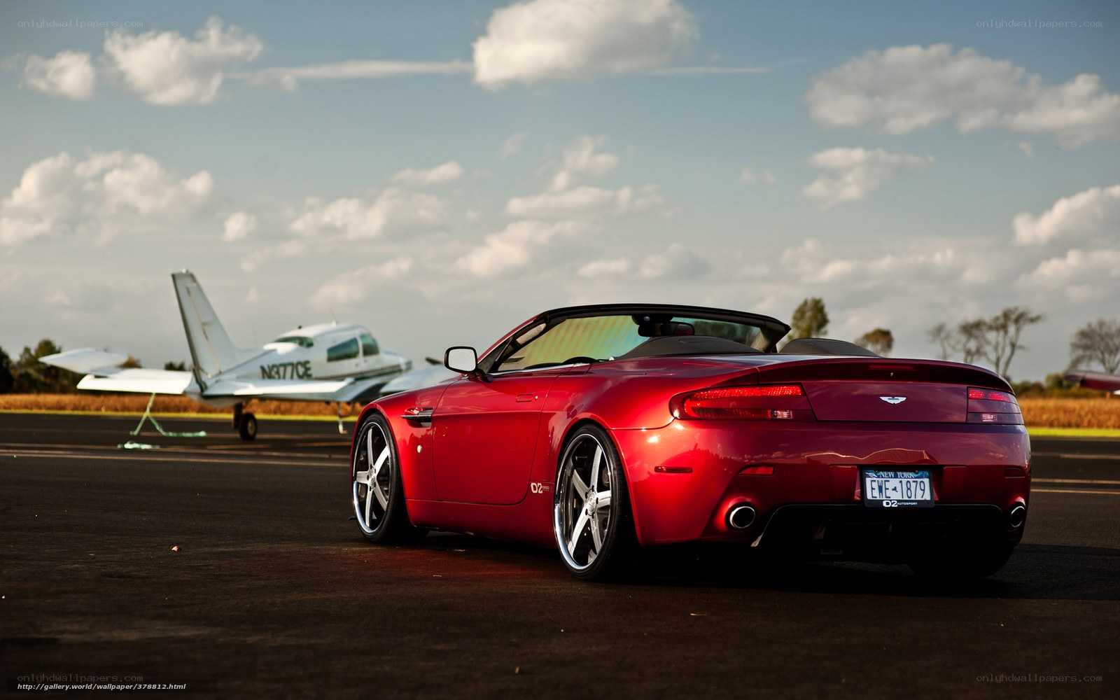 Red convertible on airfield