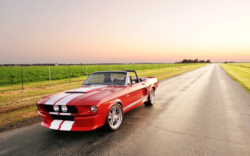 Red convertible on country road