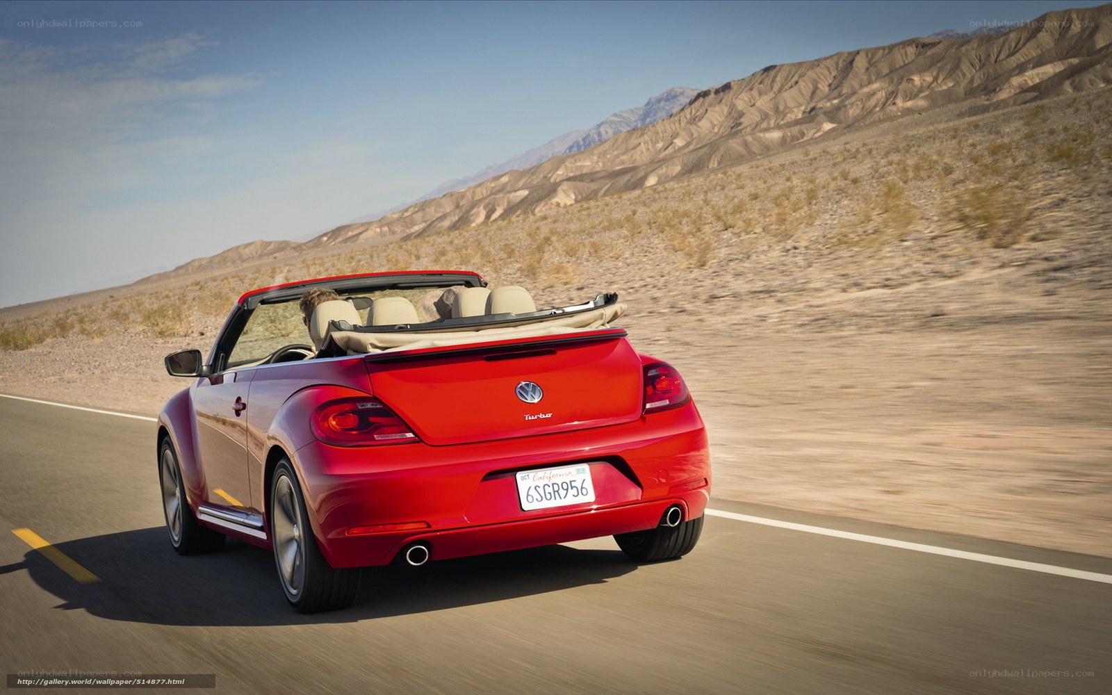 Red convertible on desert road