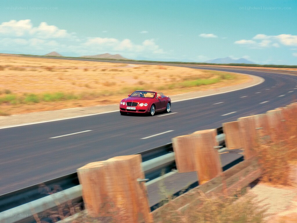 Red convertible on desert road