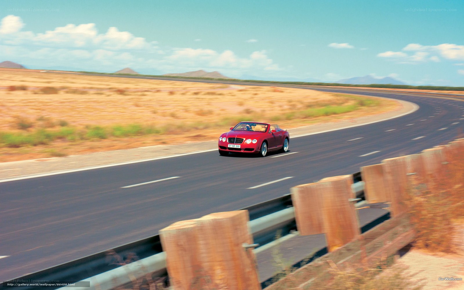 Red convertible on desert road