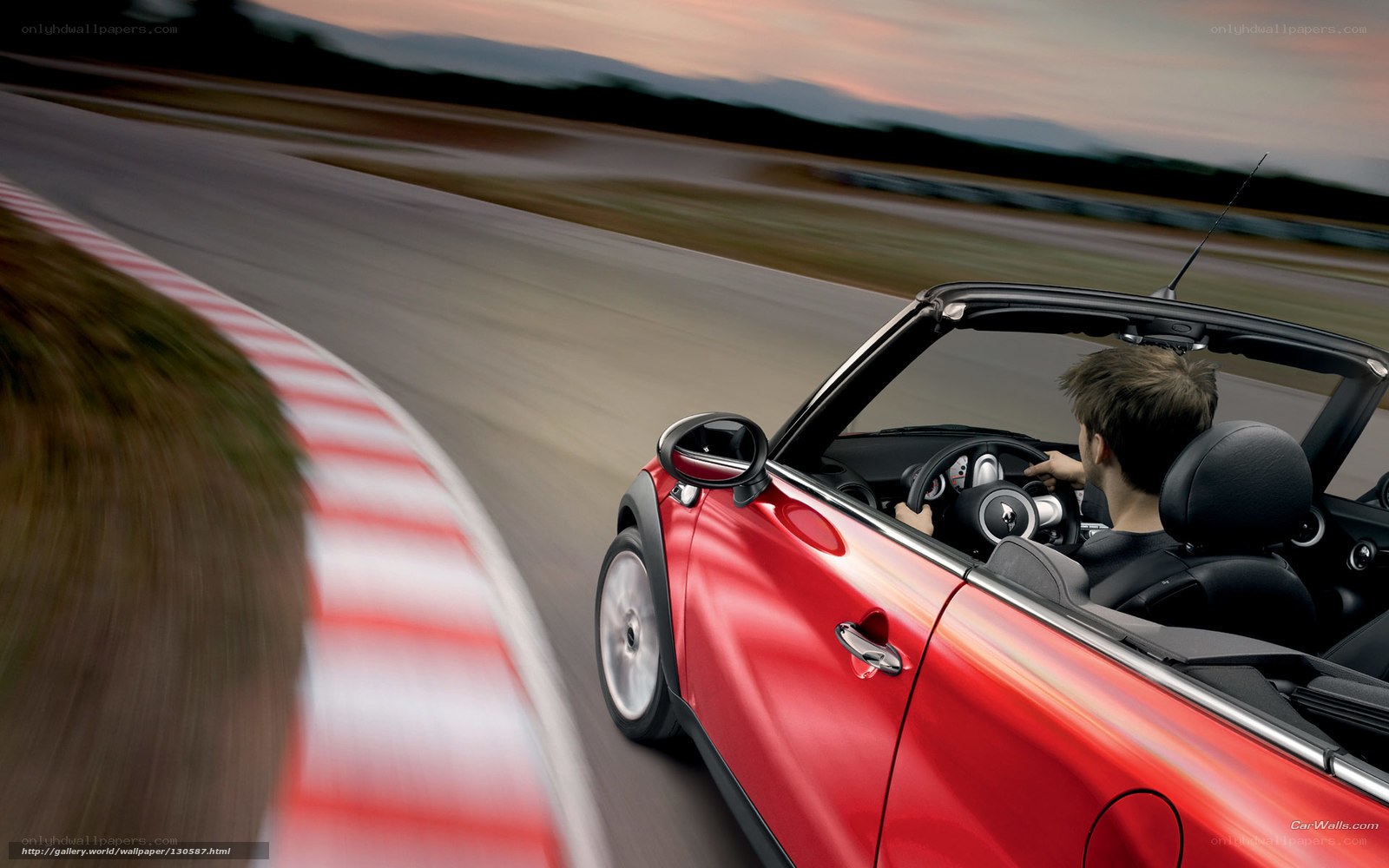 Red convertible on racetrack