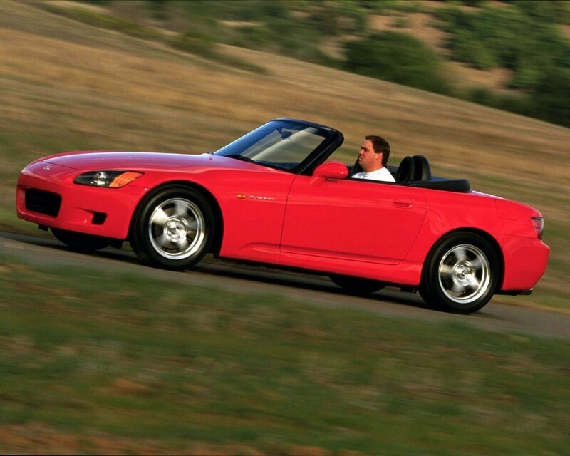 Red convertible sports car driving