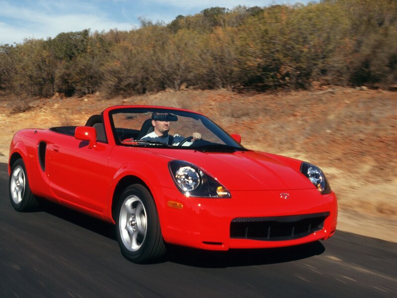 Red convertible sports car driving