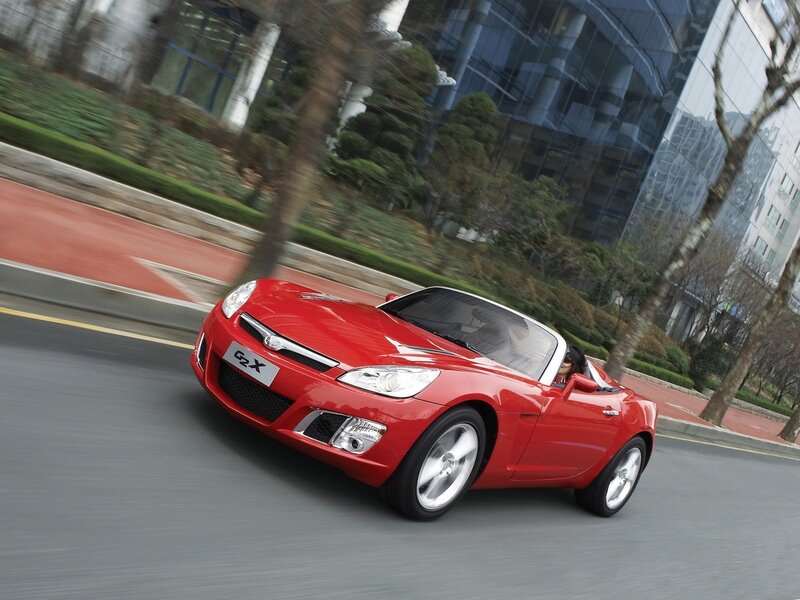 Red convertible sports car in motion
