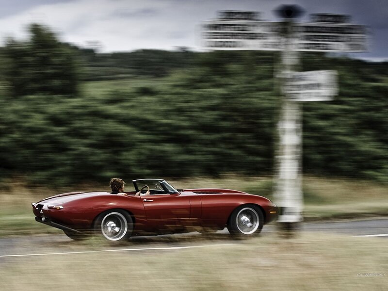 Red convertible sports car in motion