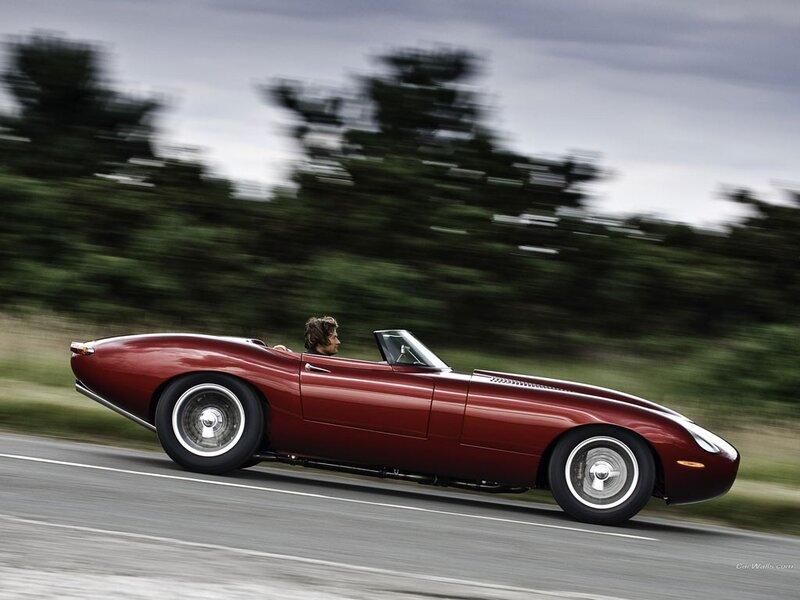 Red convertible sports car in motion