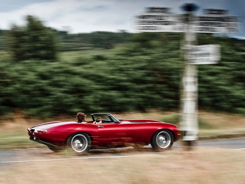 Red convertible sports car in motion
