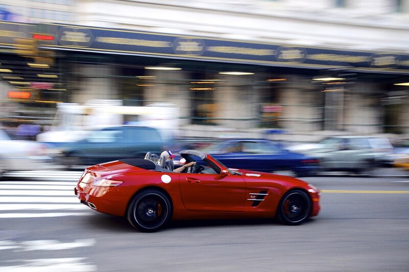 Red convertible sports car in motion
