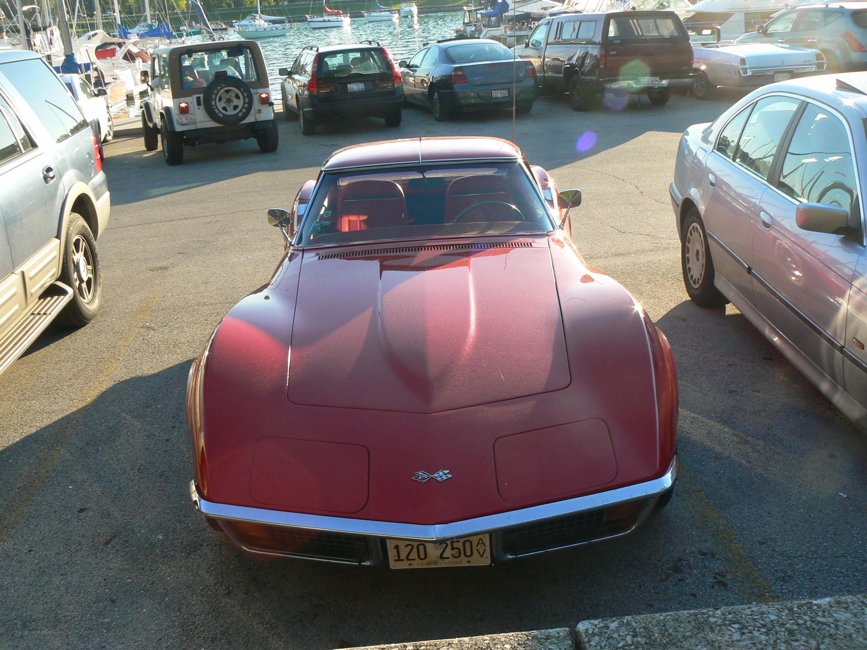 Red Corvette at marina parking