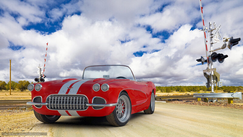 Red Corvette at railroad crossing