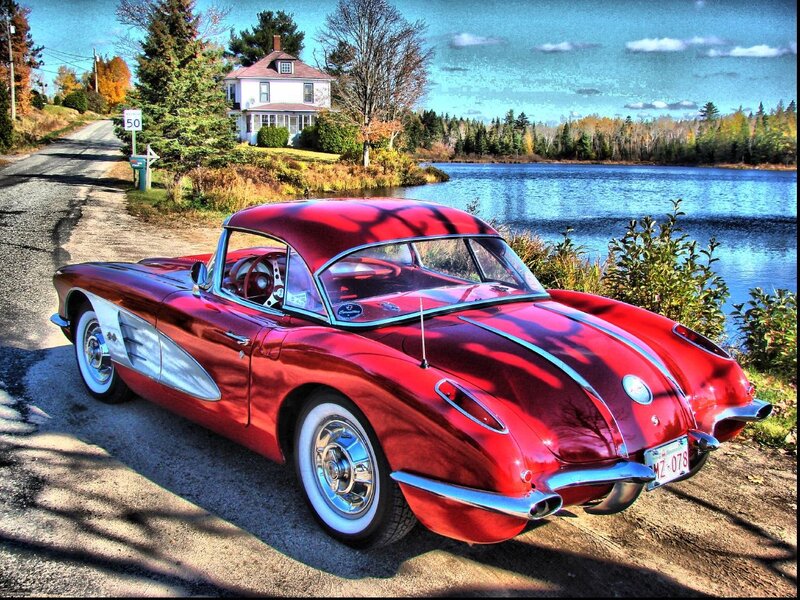 Red Corvette by a lake