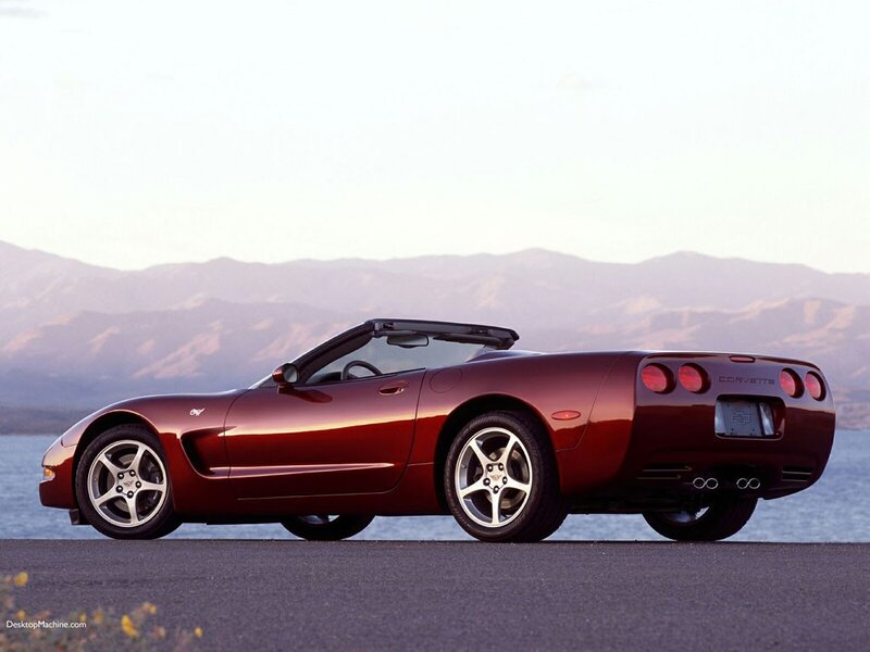 Red Corvette convertible by the water