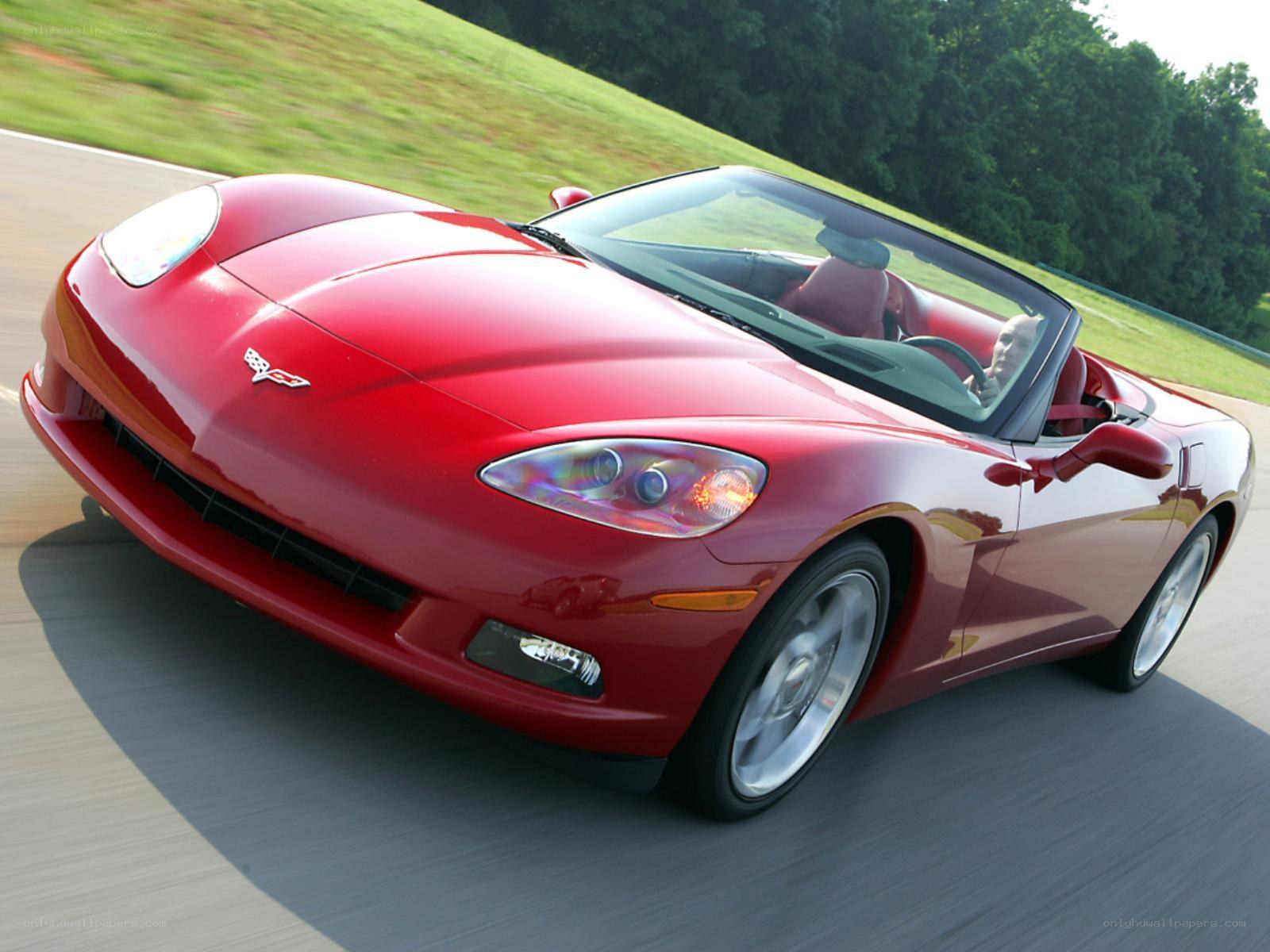 Red Corvette convertible in motion