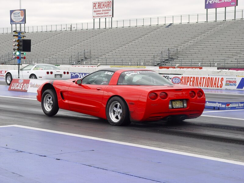 Red Corvette drag racing