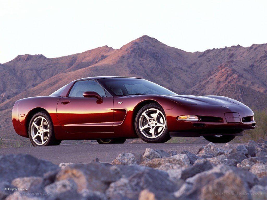 Red Corvette in desert landscape