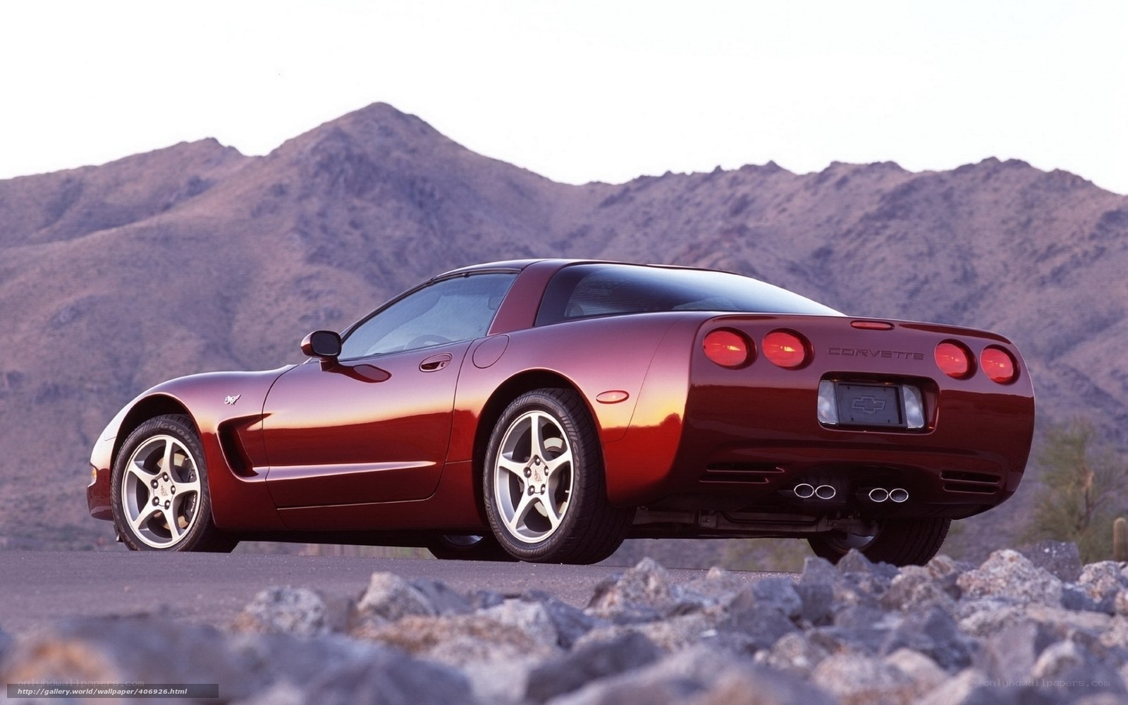 Red Corvette in desert landscape