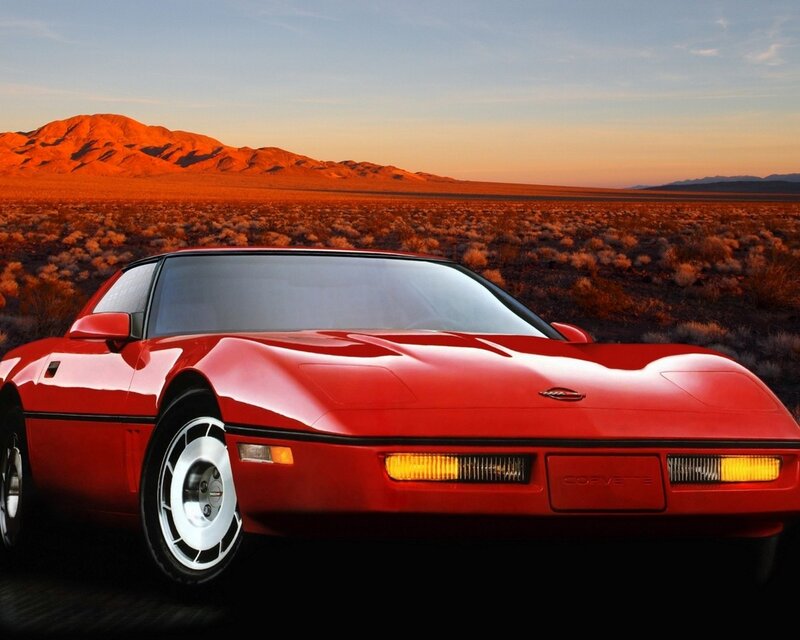 Red Corvette in desert sunset