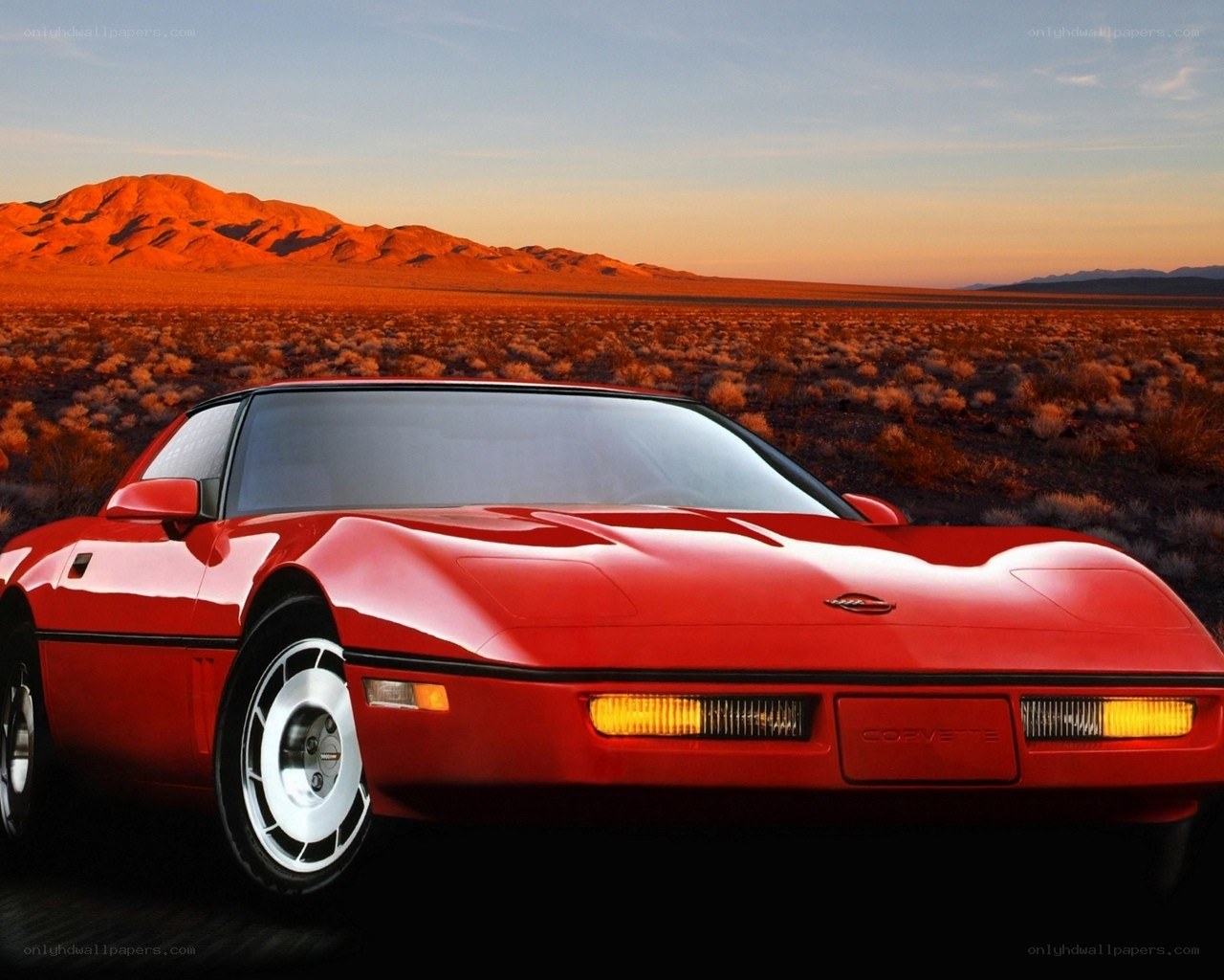 Red Corvette in desert sunset