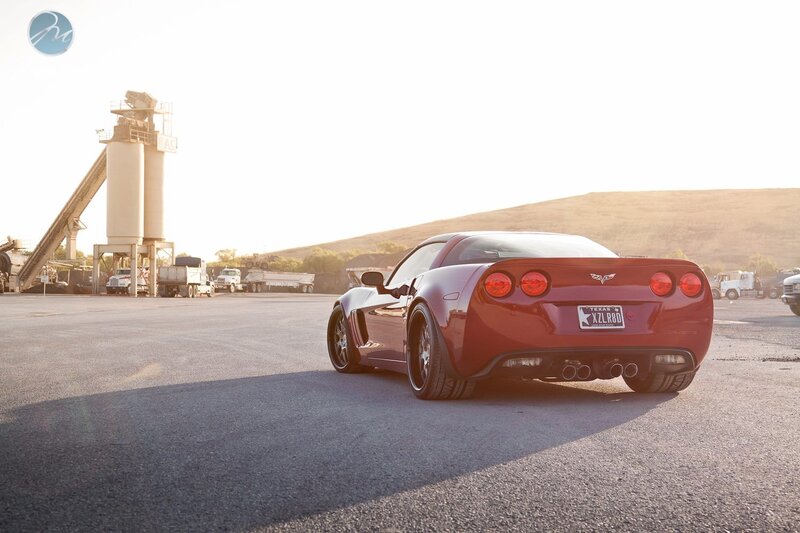 Red Corvette in industrial lot
