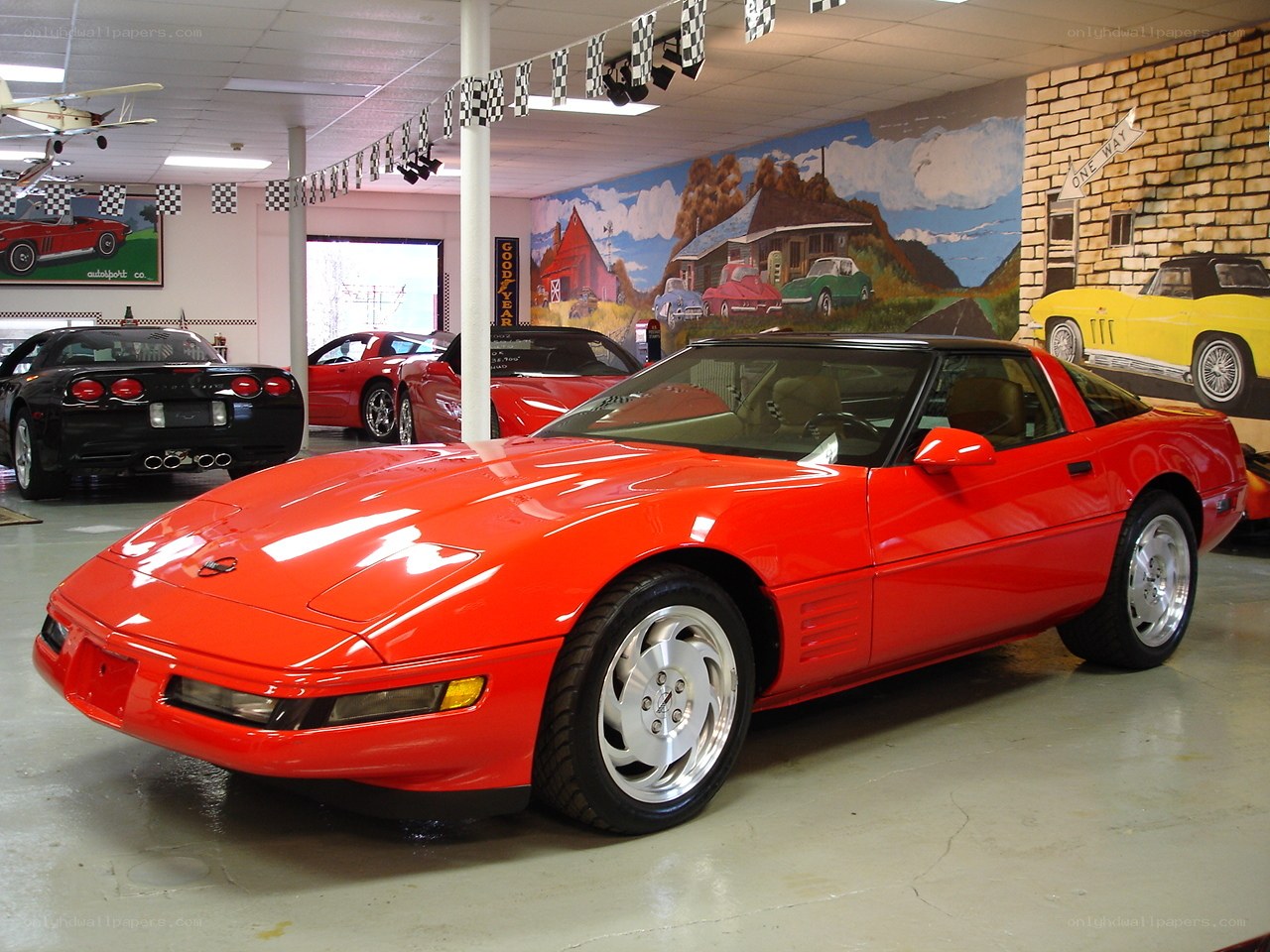 Red Corvette in showroom