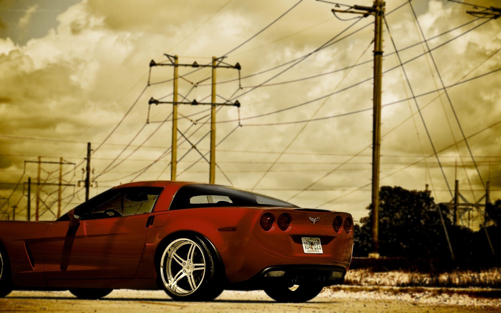 Red Corvette on a cloudy day