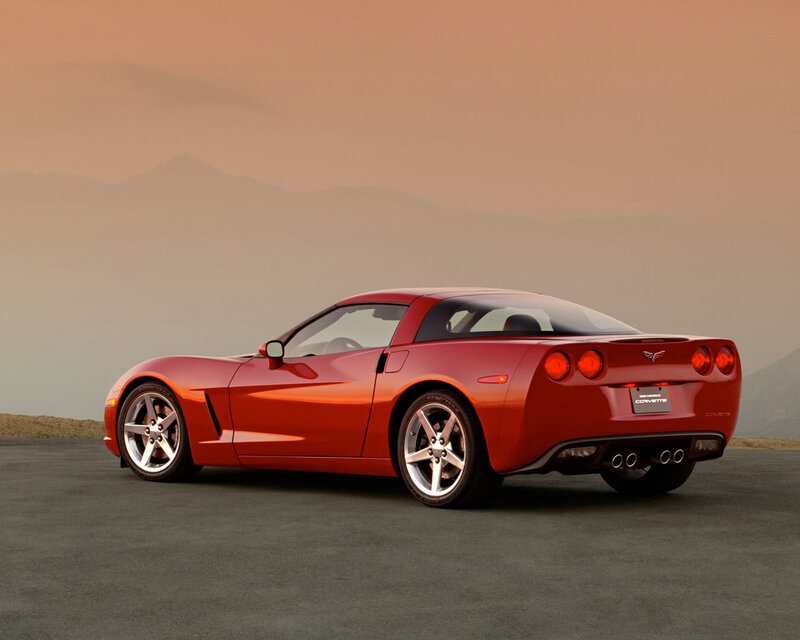 Red Corvette on a mountain road