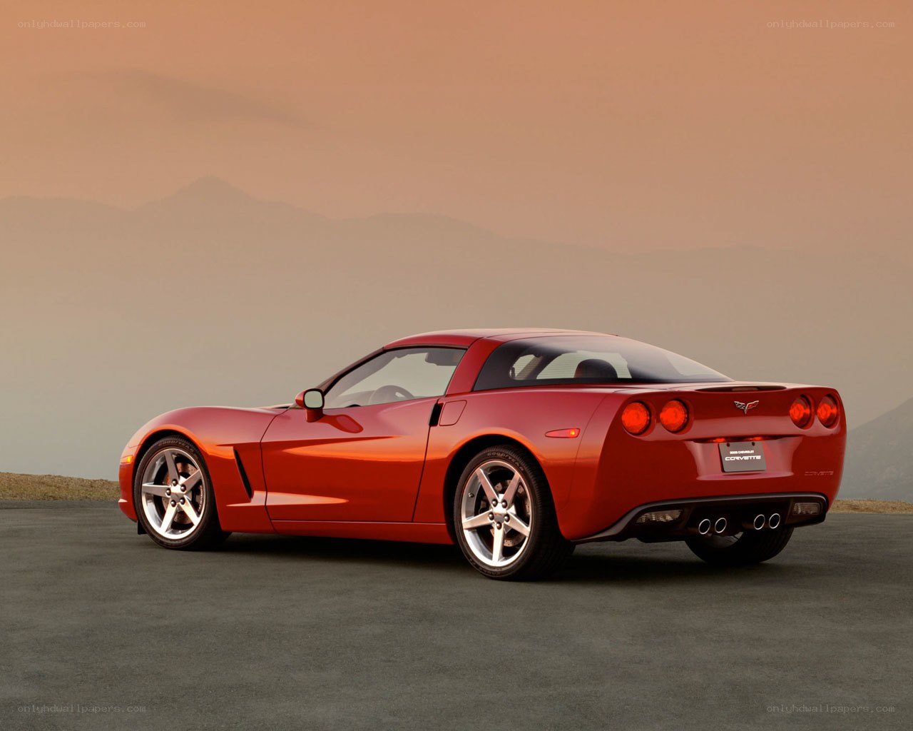 Red Corvette on a mountain road