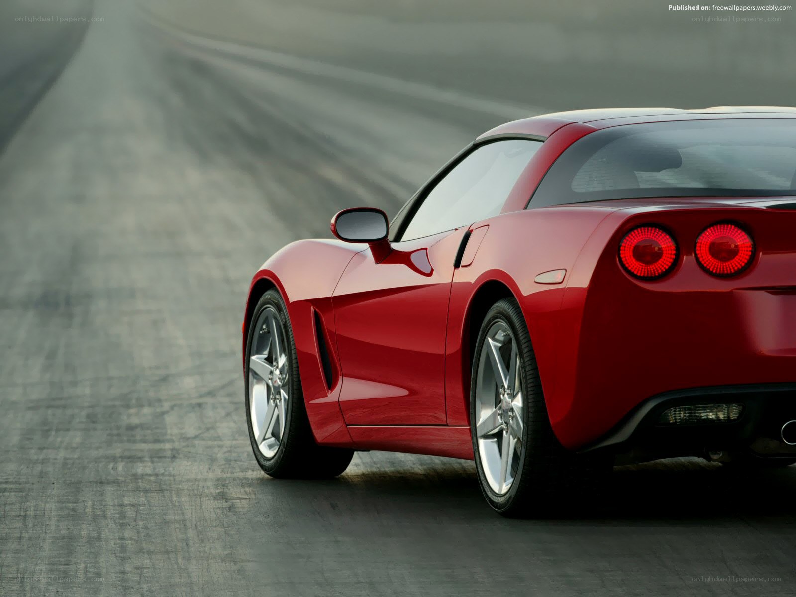 Red Corvette on a racetrack