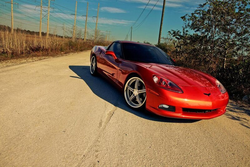 Red Corvette on a rural road