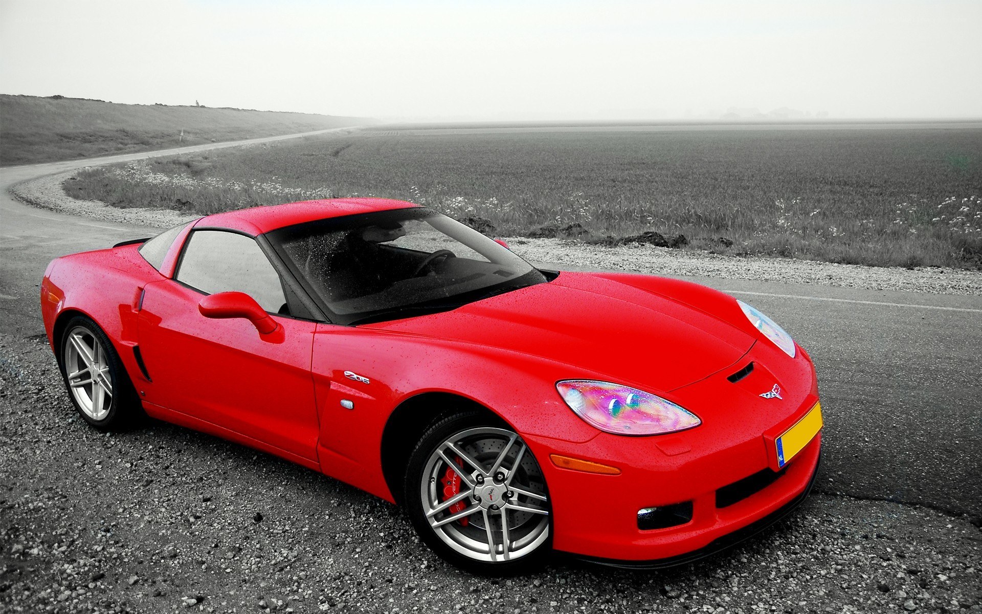 Red Corvette on a rural road