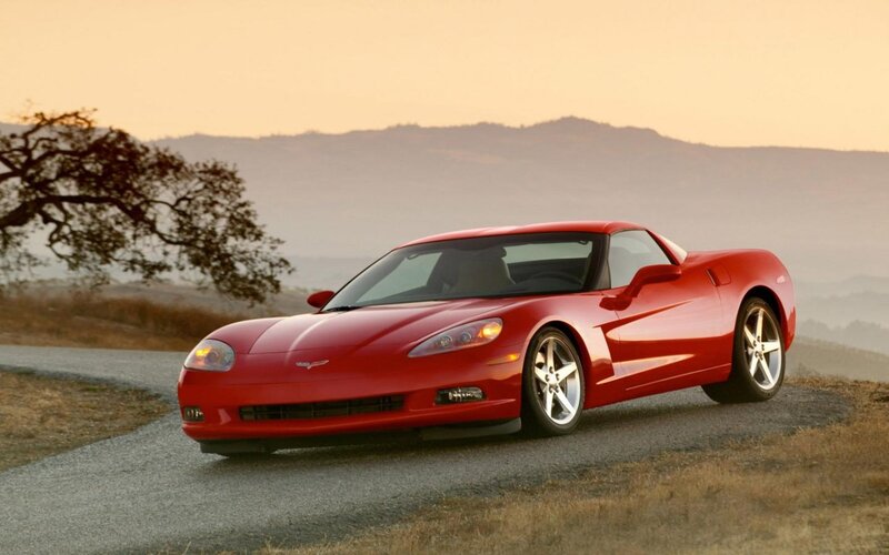 Red Corvette on a winding road
