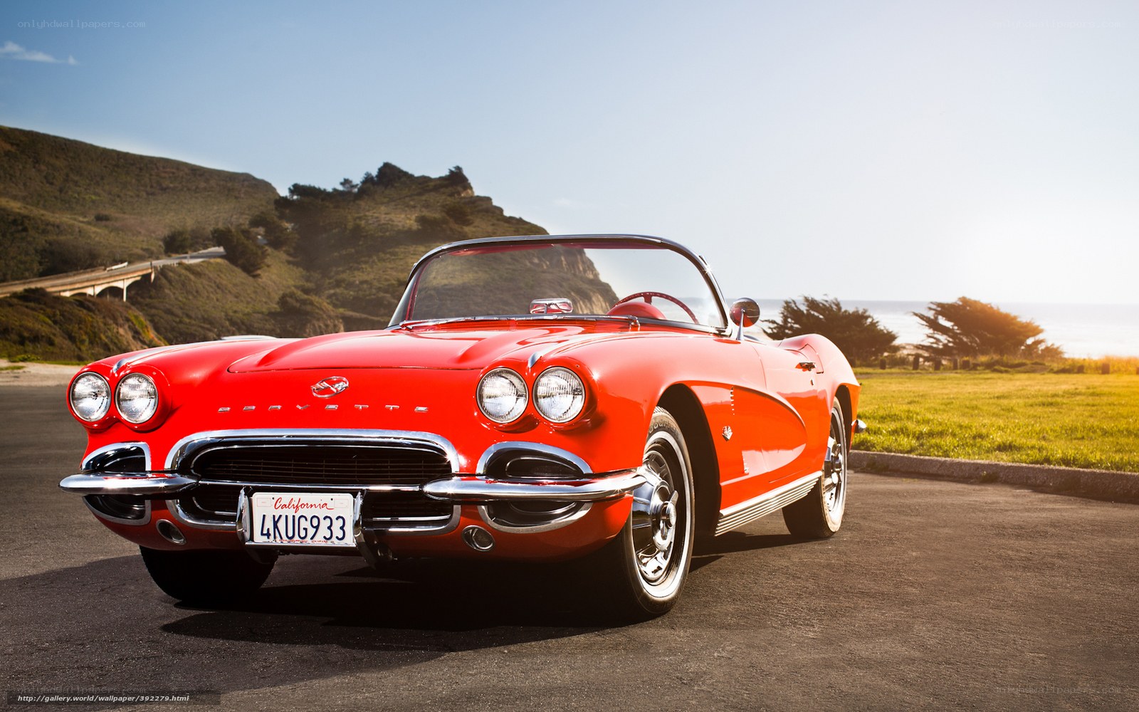 Red Corvette on coastal road