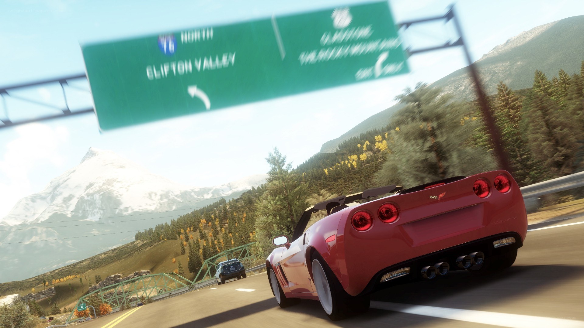 Red Corvette on mountain highway