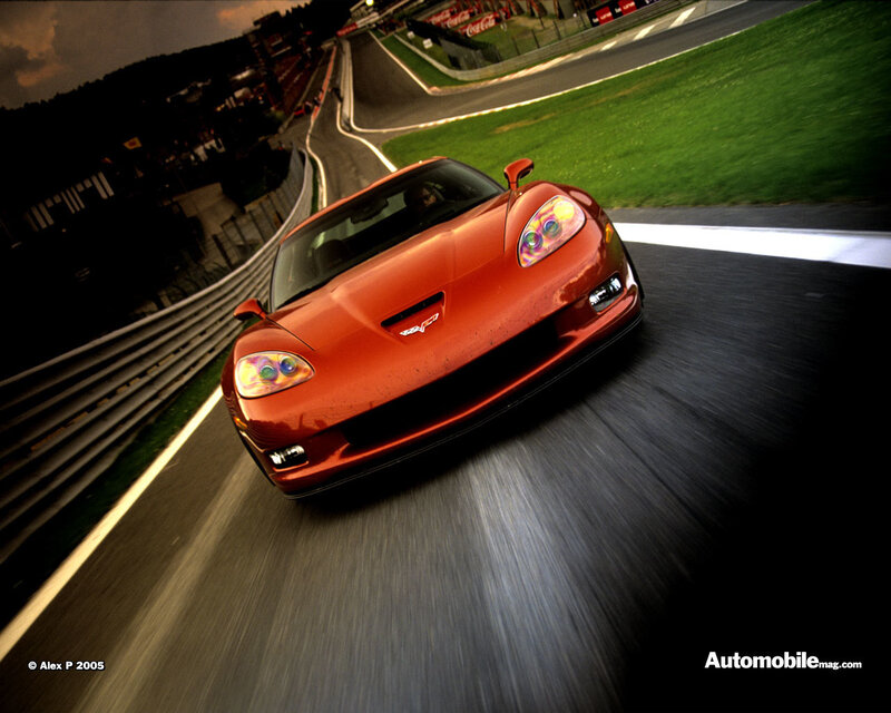 red corvette on racetrack