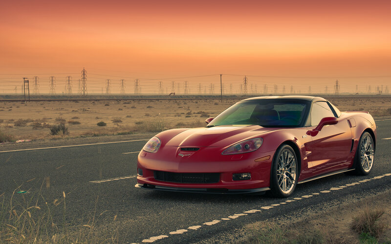 Red Corvette on Road — Dramatic
