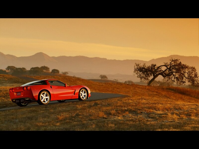 Red Corvette on Road — Serene, Sunset, Photograph