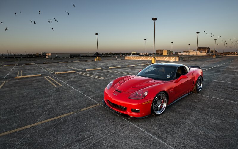 Red Corvette on rooftop parking