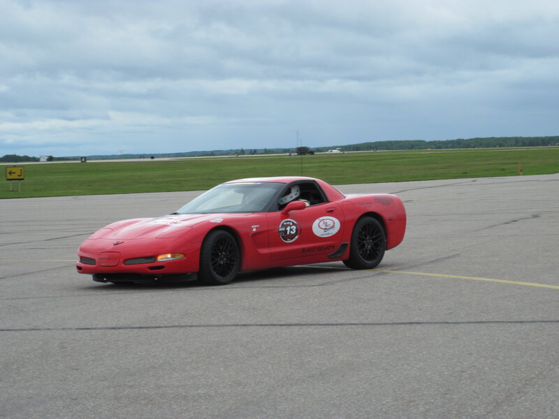 Red Corvette on Track — Overcast