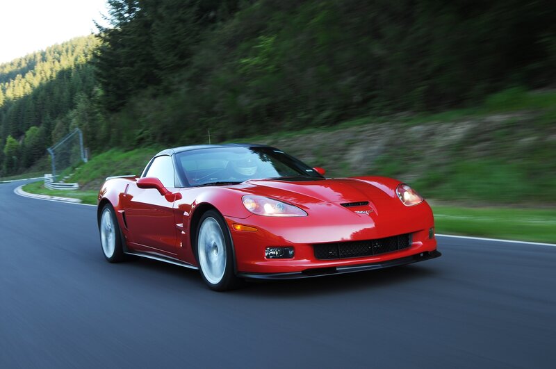red corvette on winding road