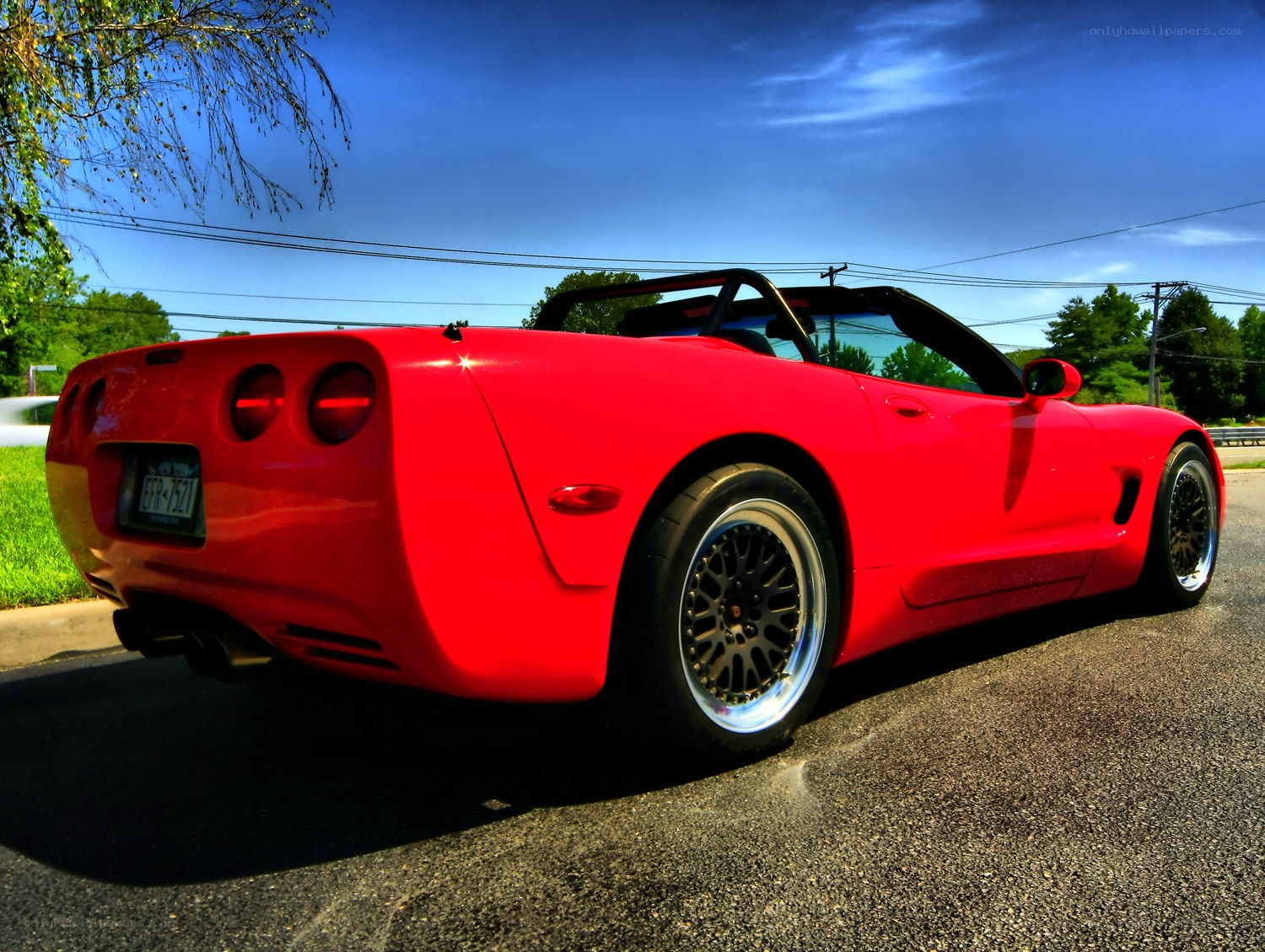 Red Corvette parked on street