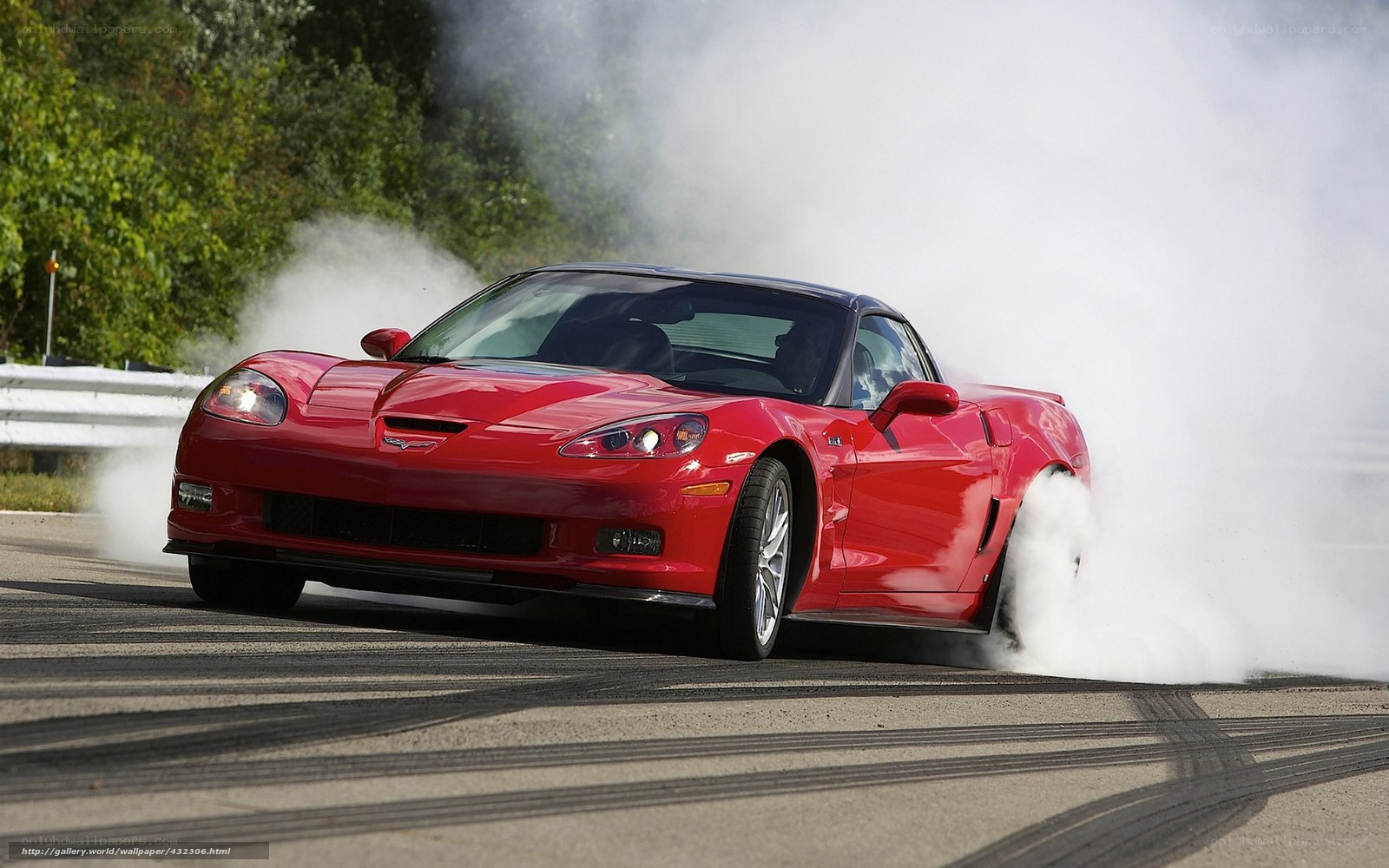 Red Corvette performing burnout