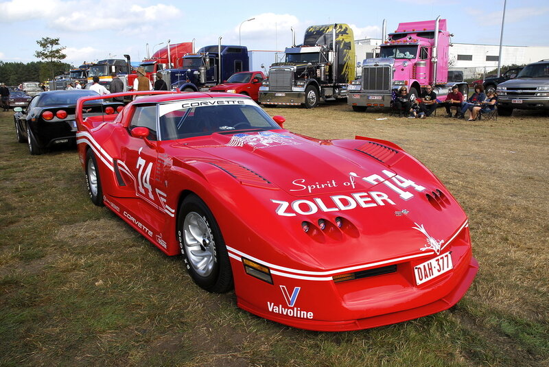 Red Corvette race car at outdoor event